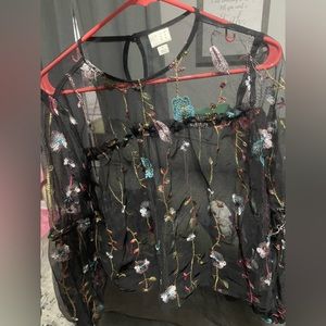 A new day sheer black blouse. It’s so pretty never been worn.